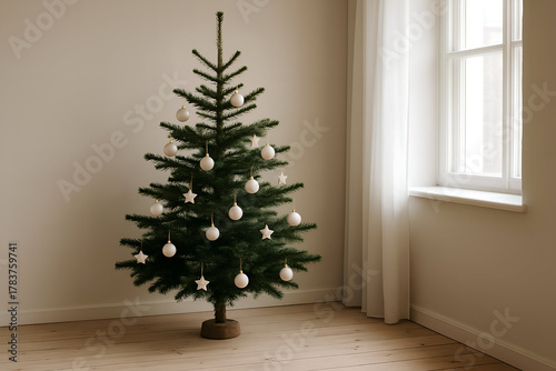 Beautifully decorated Christmas tree stands cozy room, adorned with white ornaments and stars, creating warm and festive atmosphere. Natural light filters through window, enhancing serene ambiance