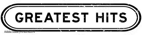 Grunge black greatest hits word rubber seal stamp on white background