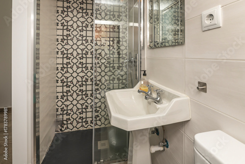 Obraz na plátne Contemporary shower with a 120 cm resin tray, folding screen, and designer taps