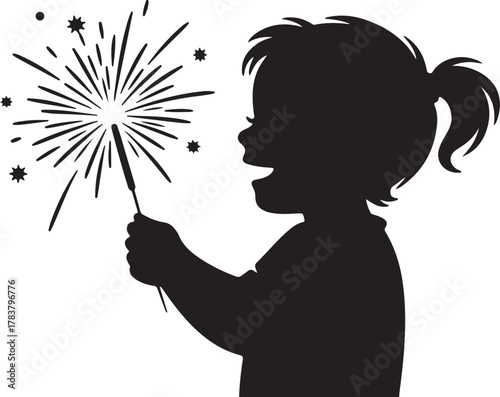 Silhouette of a child holding a sparkler with fireworks