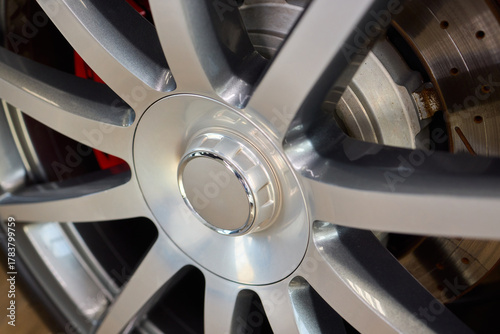 A Close Up View of a Modern Car Alloy Wheel Design Featuring Intricate Geometric Patterns