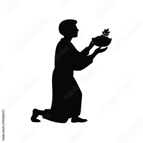 Silhouette of Person Kneeling and Holding Bowl With Leaves Spiritual Symbol