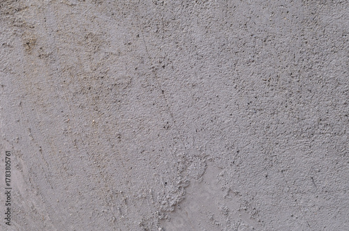 cement or concrete wall texture with plaster grains of sand
