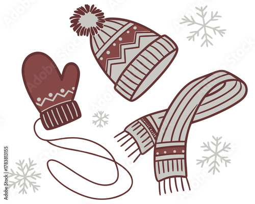 Cozy winter hat mitten and scarf with snowflakes