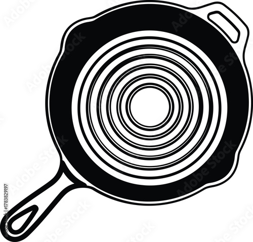 Black and white illustration of a cast iron skillet with concentric circles