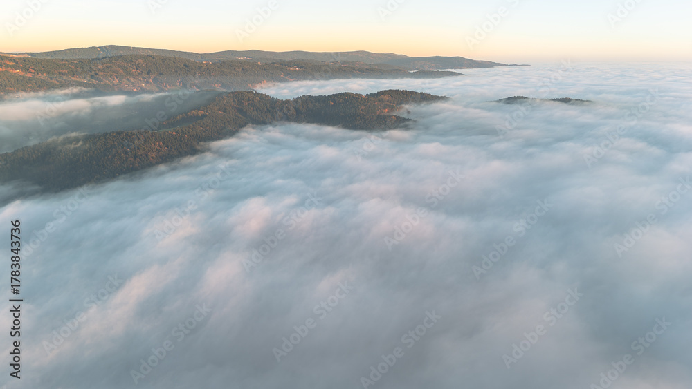Obraz premium Golden evening fog covering Bavarian hills and valleys aerial view of calm autumn landscape in southern Germany