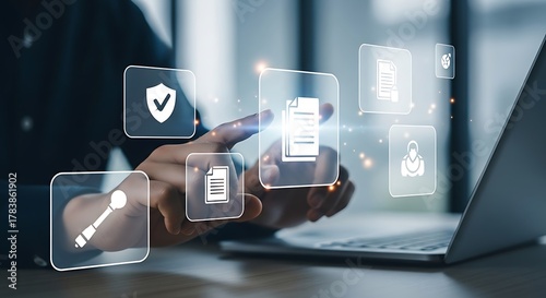 Wallpaper Mural Person interacting with digital documents and security icons on a futuristic holographic interface displaying data management and compliance concepts Torontodigital.ca