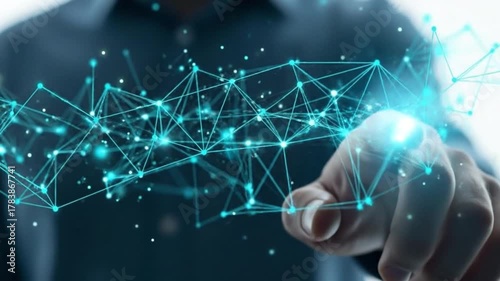 Close up of a hand touching a glowing blue digital network connection