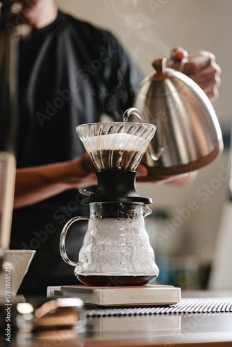 pouring manual brew coffee