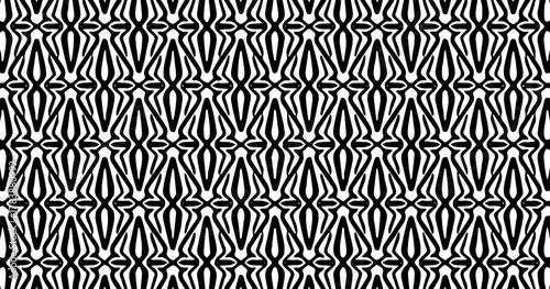 Dense black and white geometric pattern with repeated vertical and curved shapes forming an abstract texture.