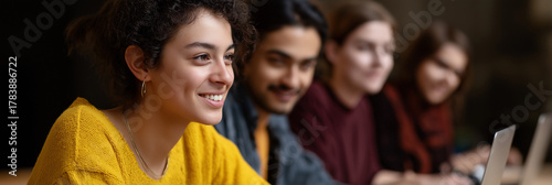 A diverse group of students actively engaged in learning, showcasing collaboration and camaraderie in an educational environment characterized by creativity and teamwork.