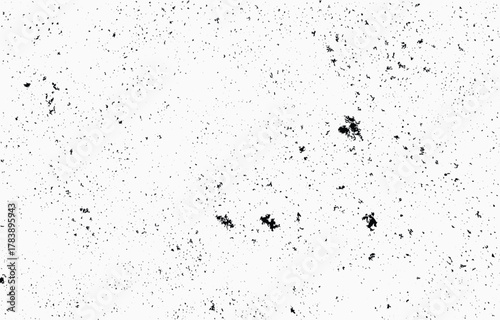 Grunge texture vector featuring a random pattern of black specks on a white background for use in design projects or artistic applications
