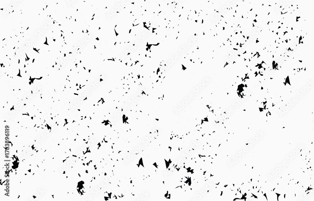 Obraz premium Grunge texture vector showing scattered black shapes on a white background, suitable for various design projects needing an edgy look and feel