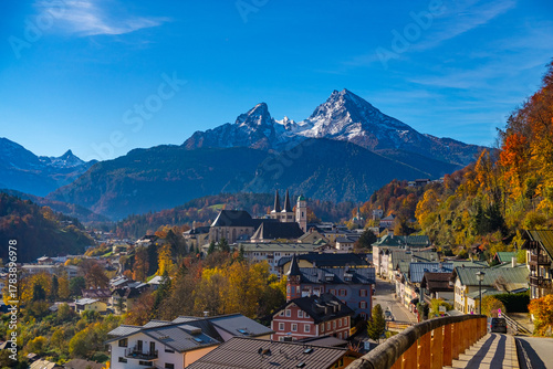 Autumn landscape near Berchtesgarden in Southern Germany with autumn forest with fog and the view of fail foliage and the mountainous town