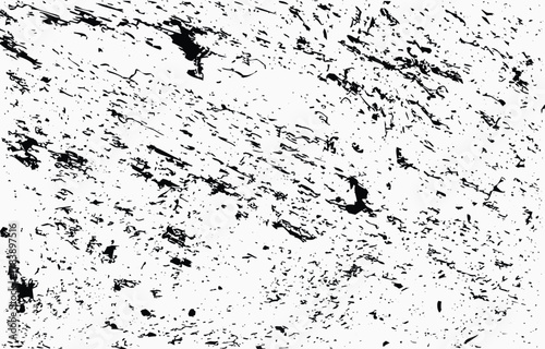 Grunge texture vector with random black splatters on a white background ideal for design projects and artistic creations