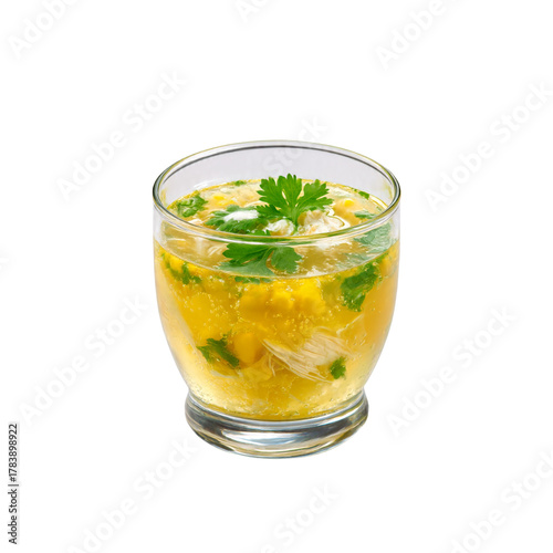 a full transparent bowl of  Hot and spicy chicken corn soup with fresh coriander, transparent glass of soup, chinese chicken corn soup, healthy soup, diet food