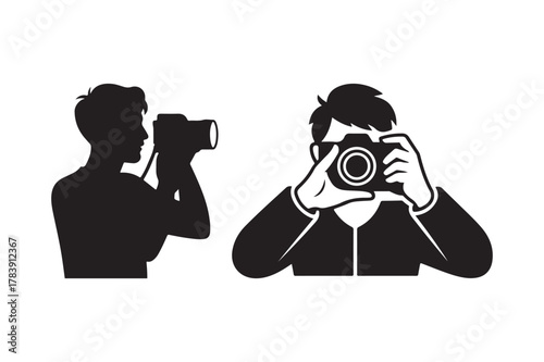Two photographers one in silhouette capturing images with cameras