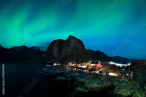 Aurora Borealis (northern lights) on the Lofoten Islands in Norway during winter. Hamnøy northern lights. Taken from the Hamnøy bridge.
