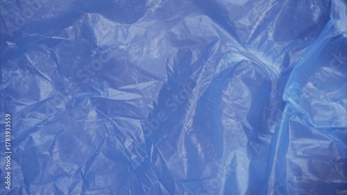Abstract blue plastic texture animation — glossy crumpled surface
