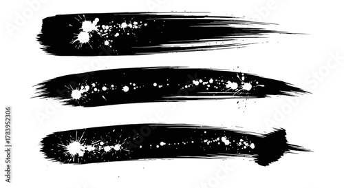 Dynamic black brush strokes with splatters, perfect for striking designs, artistic projects, and bold creative compositions