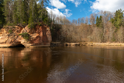 Latvia. Ligatne. View of the rock and trees on a sunny day in spring.