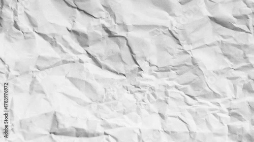 Dynamic crumpled paper texture shifting and unfolding, ideal for artistic animation and background effects, creating a sense of transformation