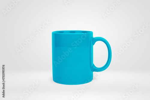 Isolated Cyan Blue Ceramic Coffee Mug on a Minimalist White Background
