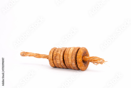 A String of Dried Figs (Anjeer) Slices on a White Minimalist Background
