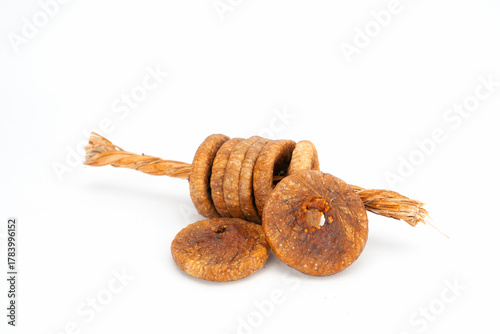 A String of Dried Figs (Anjeer) Slices on a White Minimalist Background