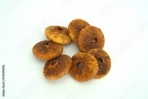 Close-up of a Small Group of Dried Fig Slices (Anjeer) on White