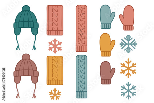 Assortment of colorful knitted winter hats mittens and scarves with snowflakes
