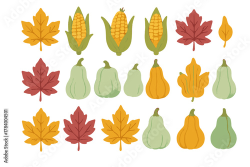 Assortment of autumn harvest vegetables and colorful maple leaves