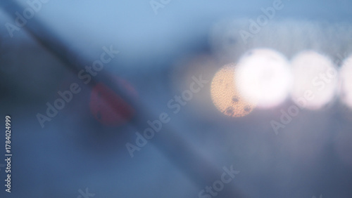 A transparent umbrella and a street out of focus, an autumn city in cloudy weather, melancholic bokeh
