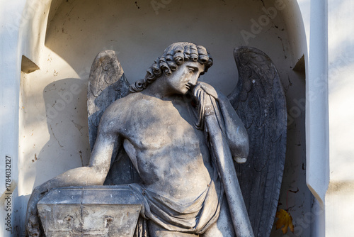 Historic Statue on the autumn mystery old Prague Cemetery, Czech Republic