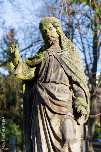 Historic Statue on the autumn mystery old Prague Cemetery, Czech Republic