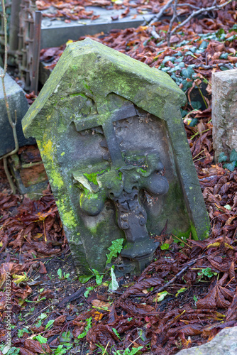 Historic Statue on the autumn mystery old Prague Cemetery, Czech Republic