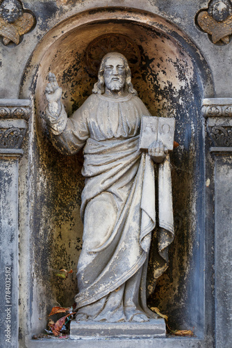 Historic Statue on the autumn mystery old Prague Cemetery, Czech Republic