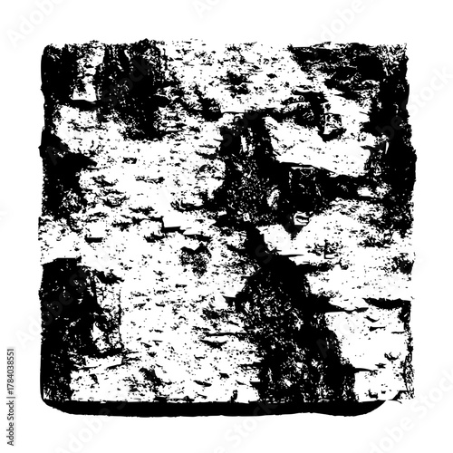 Monochrome close up of a rectangular block with a rough and textured surface in high contrast black and white
