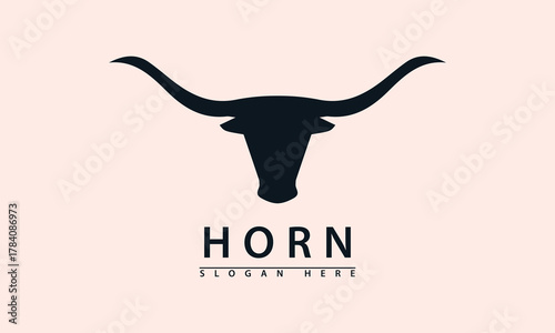 Elegant, curved bull head logo in silhouette. Represents authority, wildness, and nature. Clean design for premium or traditional brands.