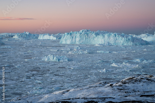 Wallpaper Mural Giant icebergs floating in Ilulisat icefjord, Greenland. Massive icebergs, calved from the Sermeq Kujalleq Glacier, float through the Ilulissat Icefjord in western Greenland Torontodigital.ca