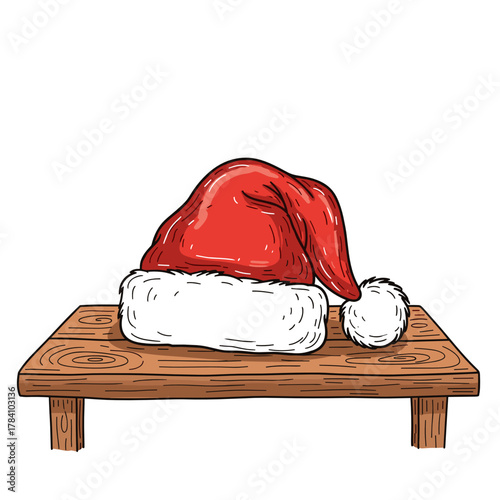 Santa hat resting on wooden table in festive holiday setting  
