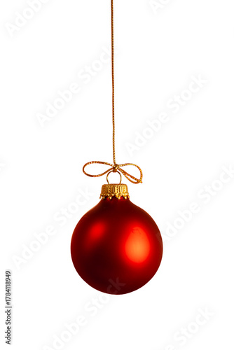 A red Christmas ball ornament hanging from a gold string with a transparent background.