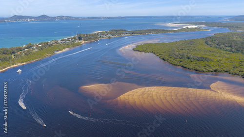 The New South Wales north coast town of Tea Gardens and the Myall river  flowing into Port Stephens.