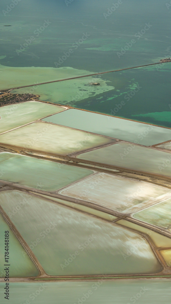 Obraz premium Aerial view of colorful salt ponds and evaporation fields in Shark Bay, Western Australia