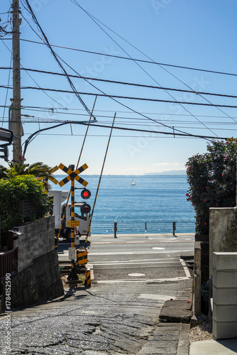 At the end of this small alley, which has been the setting for many Japanese manga and movies, you can see the train tracks and the coast.