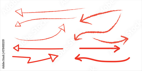 A collection of hand drawn red arrows pointing in various directions on a white background surface