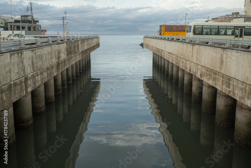 evening ocean seen from the road bridge and concrete architecture in jeju island