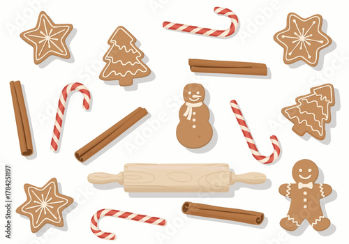 Festive assortment of gingerbread cookies, candy canes, and cinnamon sticks arranged on white background.