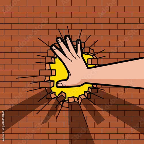Hand punching through brick wall. Breaking barrier, breakthrough and success concept.
