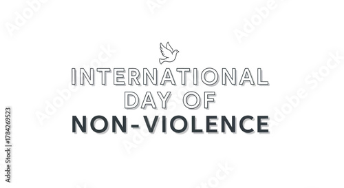 International Day of Non-Violence text with a dove symbol on a clean white background, promoting peace and awareness.